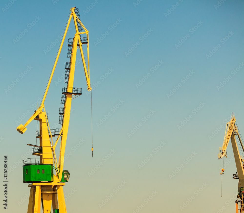 Lonely crane in port. Lonely crane in port.