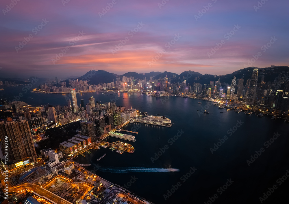 Evening aerial view panorama of Hong Kong skyline and Victoria Harbor. Travel destinations