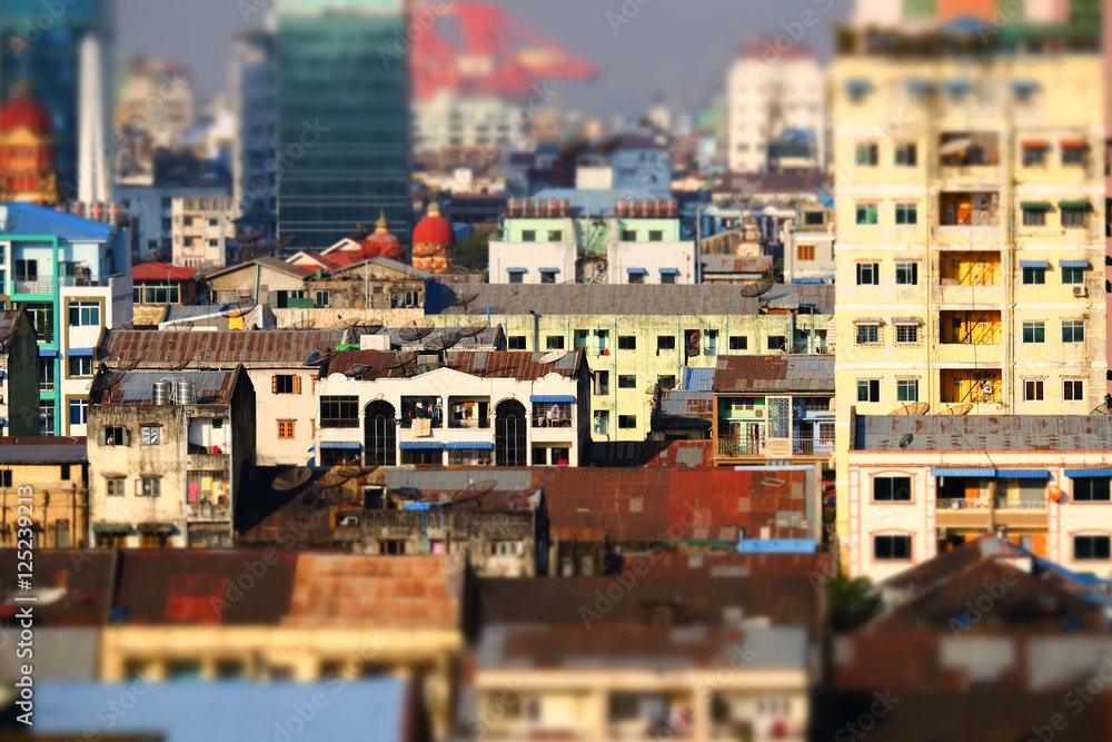 Tilt shift blur effect. Futuristic aerial view panorama of developing Yangon city. Myanmar (Burma)