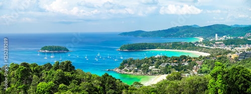 Tropical beach landscape panorama. Beautiful turquoise ocean waives with boats and sandy coastline from high view point. Kata and Karon beaches, Phuket, Thailand