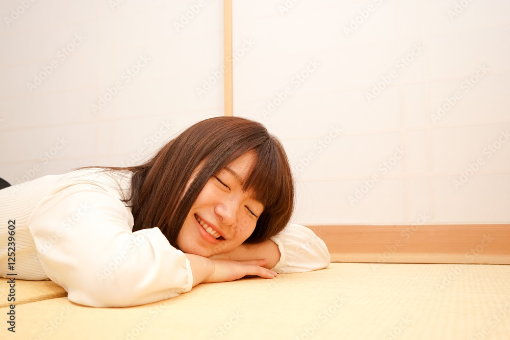 Young woman relaxing in a Japanese style room Stock Photo | Adobe Stock