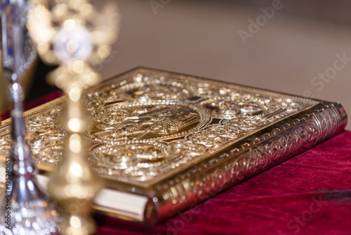 The Holy Bible in the Orthodox Church prepared for baptism ceremony in the Romanian Church