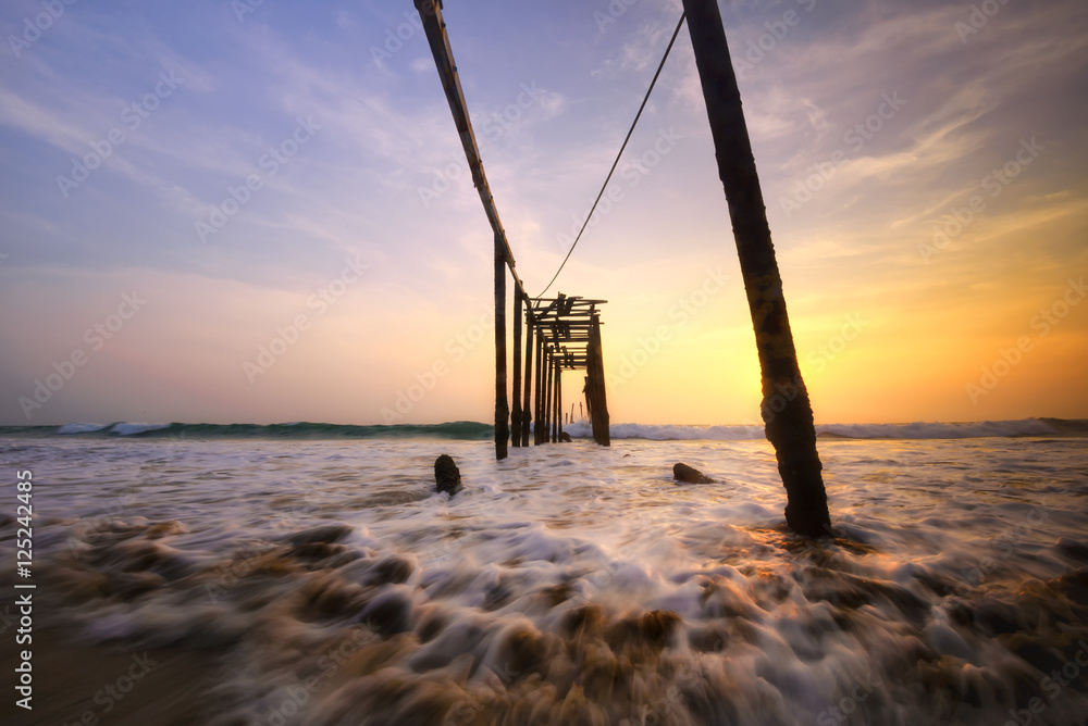 Old wooden bridge at the beach , Concept Feel lonely tone on beach.