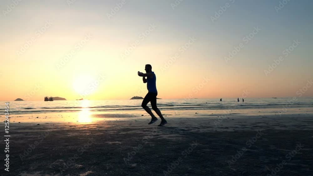 Man jogging on beach and checking pulse on smartwatch during sunset, slow motion 240fps
Man jogging on beach and checking pulse on smartwatch during sunset, slow motion 240fps