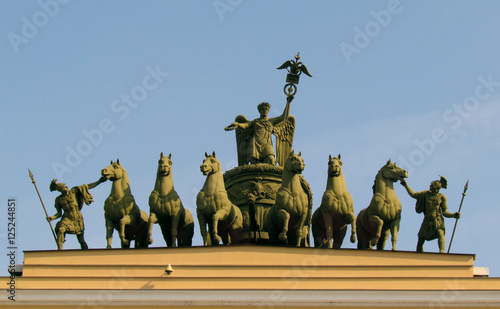 Arch with horses in St. Petersburg on a background of blue sky