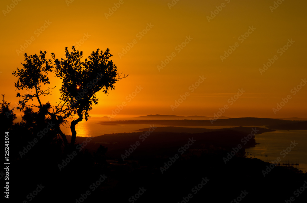 view of the sunset over an archipelago of islands in croatia during summer , Losinj Island