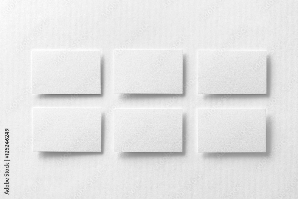 Mockup of white business cards arranged in rows at design paper Mockup of white business cards arranged in rows at design paper