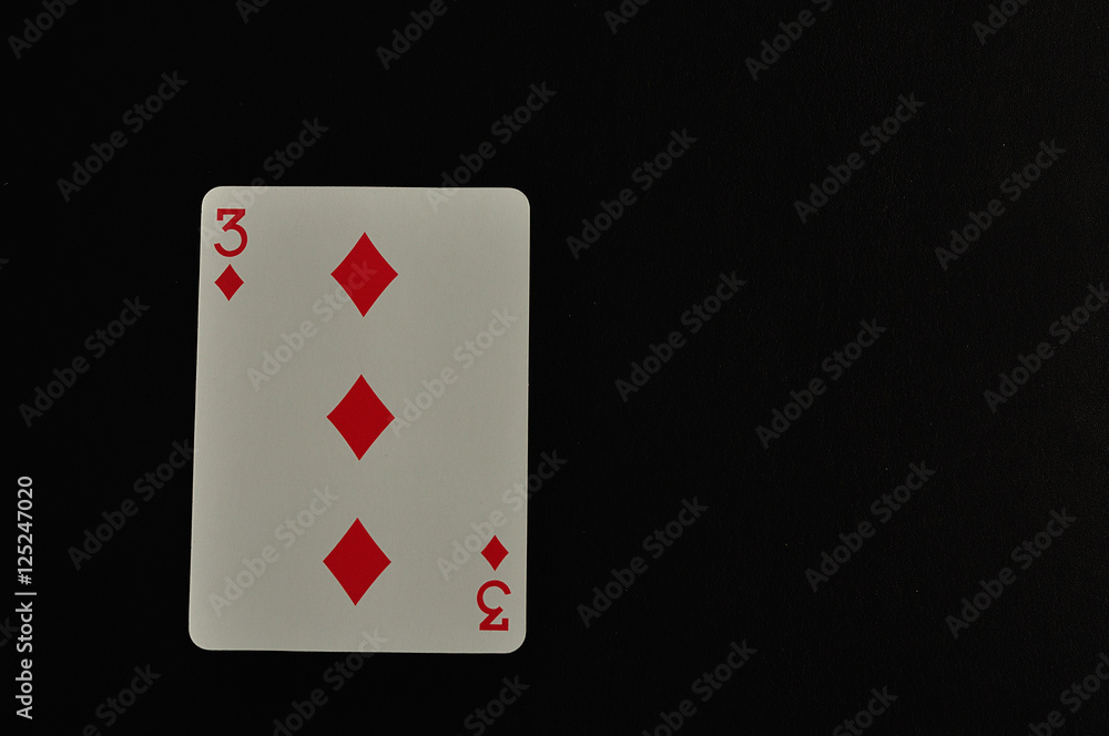 Obraz premium Playing card. Three of diamond isolated on a black background