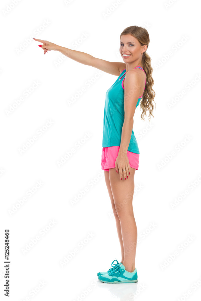 Woman In Sport Clothes Pointing Woman In Sport Clothes Pointing