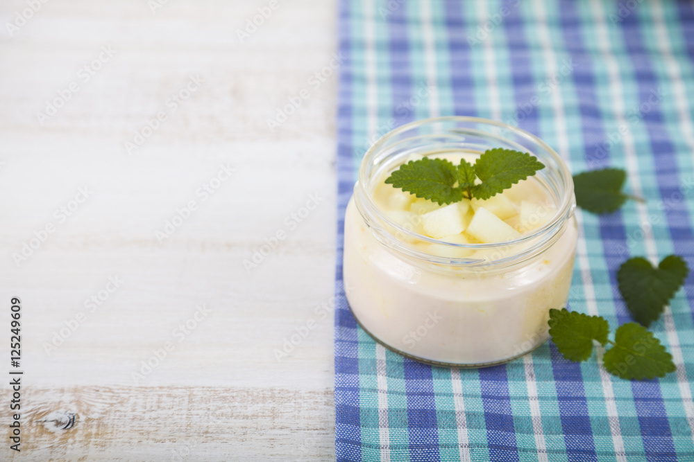 Yogurt and smoothie with melon on a wooden table. Yogurt and smoothie with melon on a wooden table.