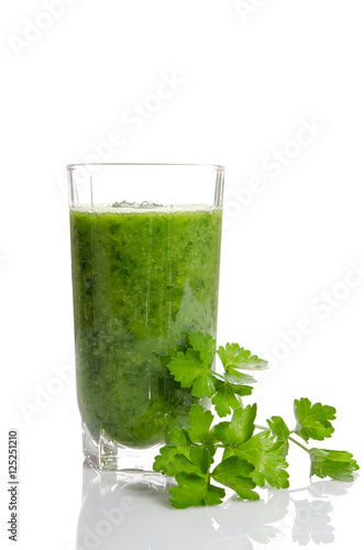 Green smoothie and parsley as healthy summer drink isolated on w