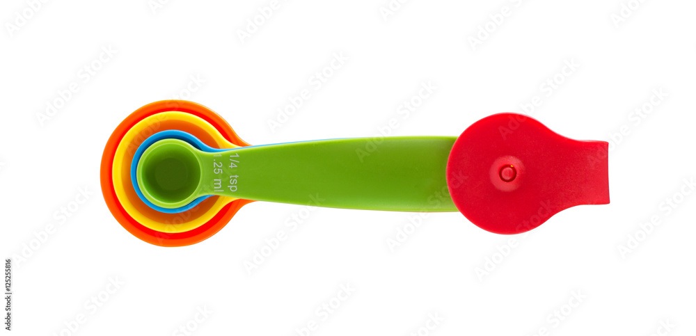 Colorful measuring spoons on white background Colorful measuring spoons on white background