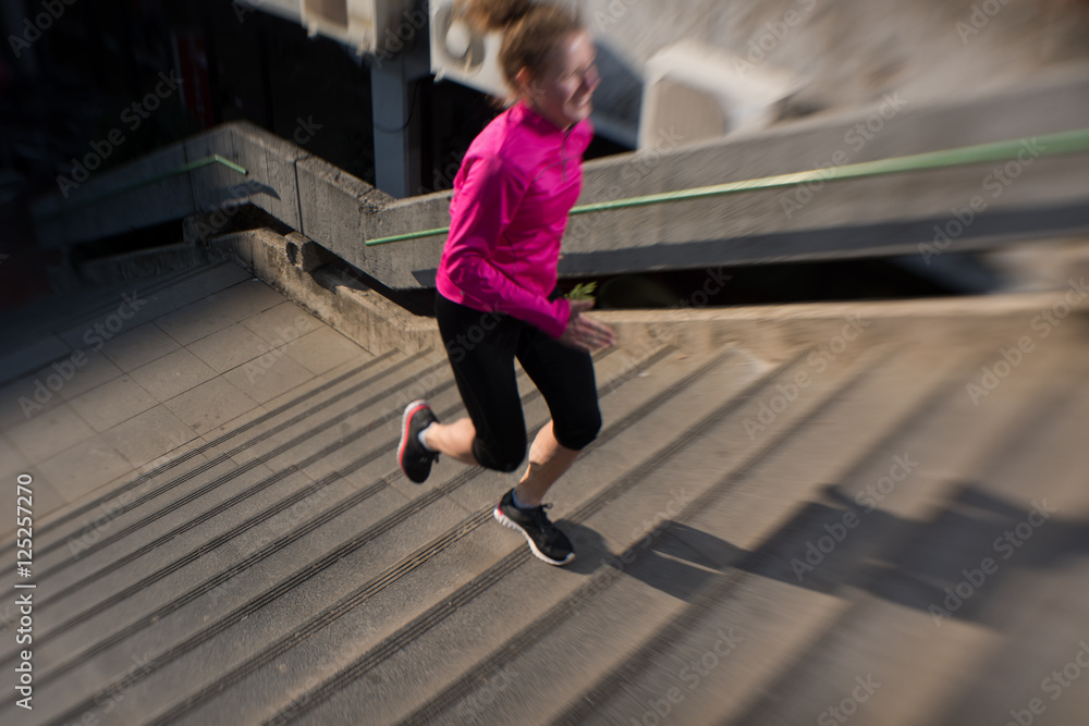 woman jogging on steps woman jogging on steps