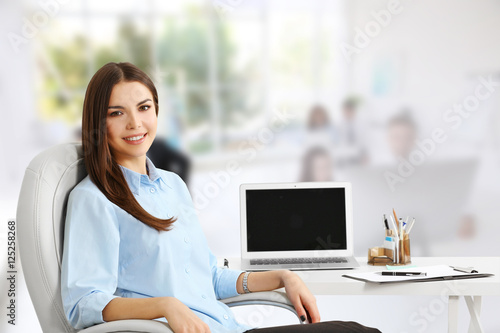Young woman working at mode...