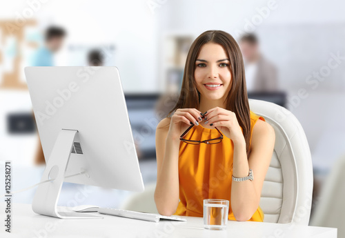 Young woman working at mode...