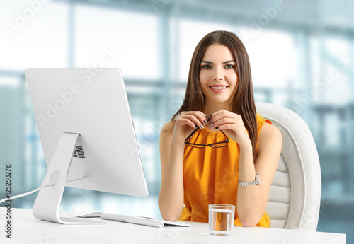 Young woman working at mode...