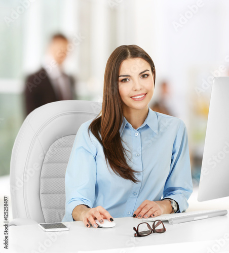Young woman working at mode...