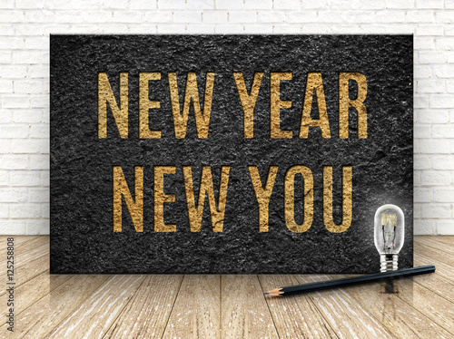 Inspiration quote,New year new you word with lightbulb and penci photo