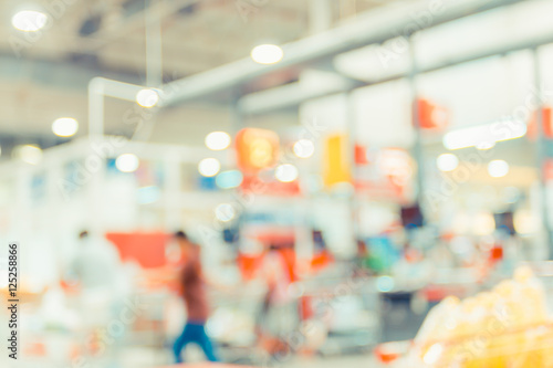 Blurred background, customer pay money at Cashier in supermarket
