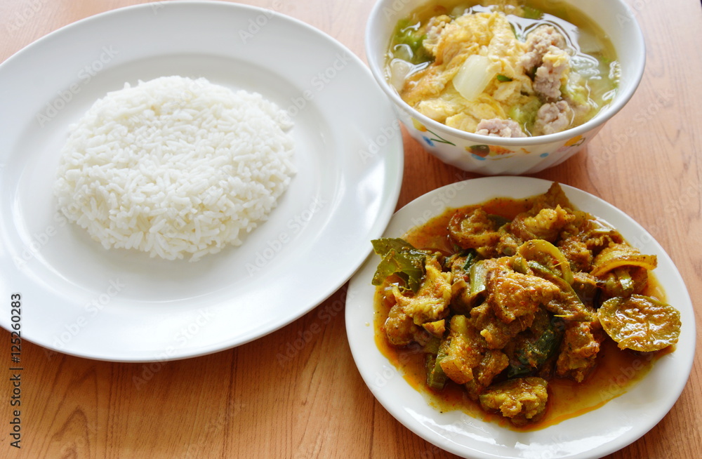 rice eat with spicy stir fried wild boar curry and egg soup rice eat with spicy stir fried wild boar curry and egg soup