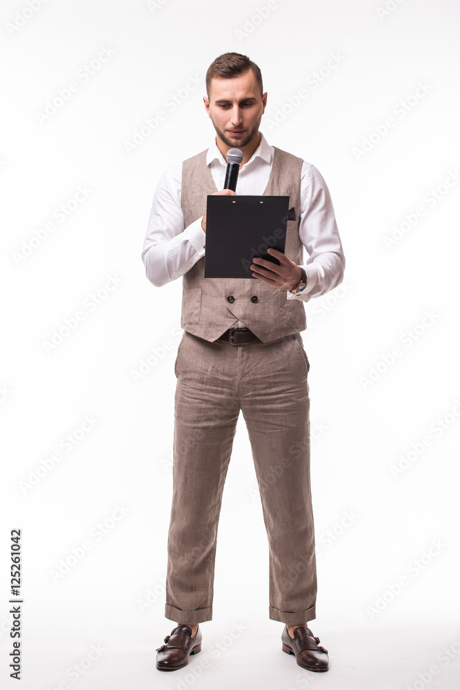 The Showman interviewer with blank. Young elegant man holding microphone against white background.Showman concept. The Showman interviewer with blank. Young elegant man holding microphone against white background.Showman concept.