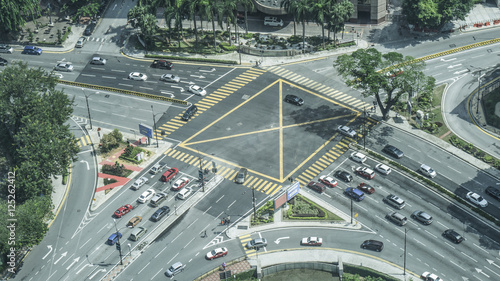Photography Top view of a city intersection and crosswalk with car and people