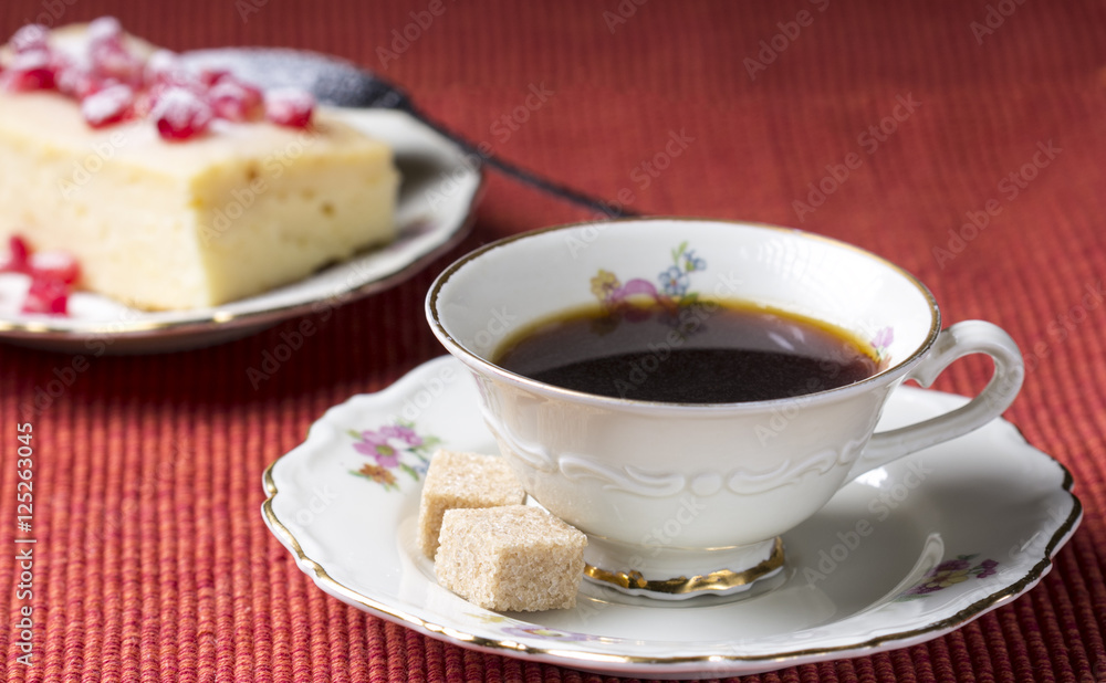 Morning Coffee and cheesecake on red tablecloth Morning Coffee and cheesecake on red tablecloth