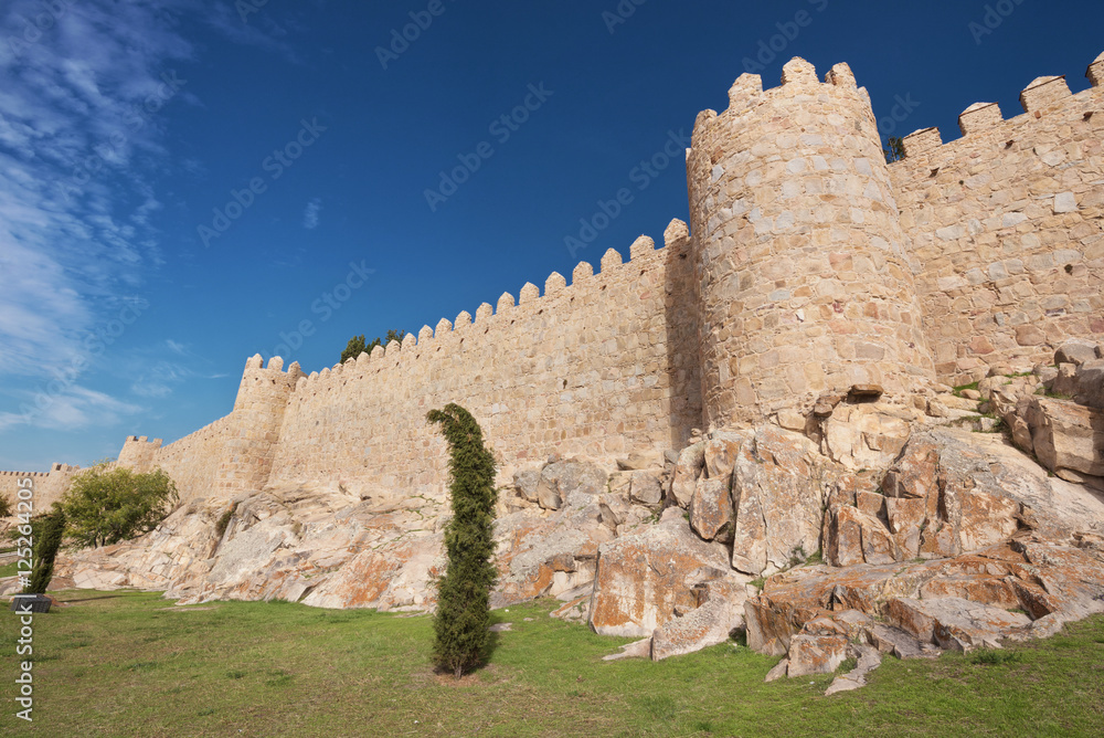 Scenic medieval city walls of Avila on a sunny day, Spain.