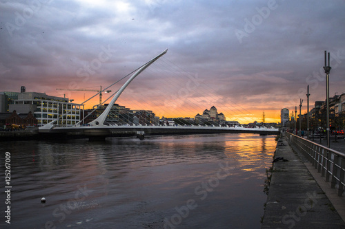 Samuel Becket Bridge in Dublin with sunset on the background