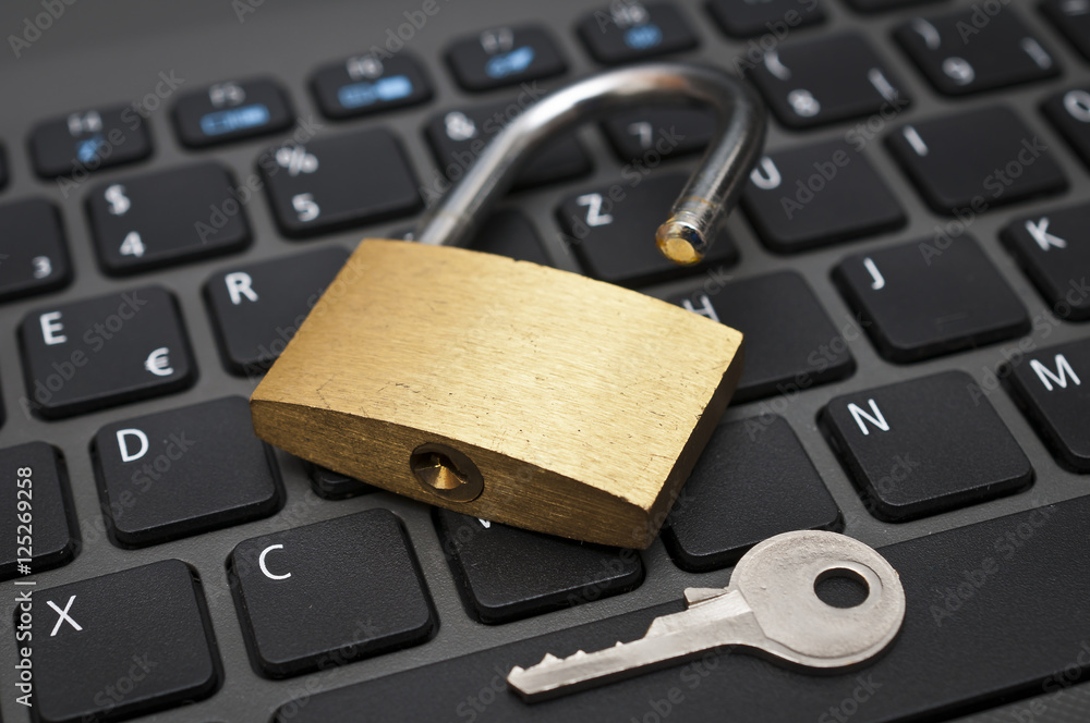 Cyber safety concept - lock on computer keyboard Cyber safety concept - lock on computer keyboard