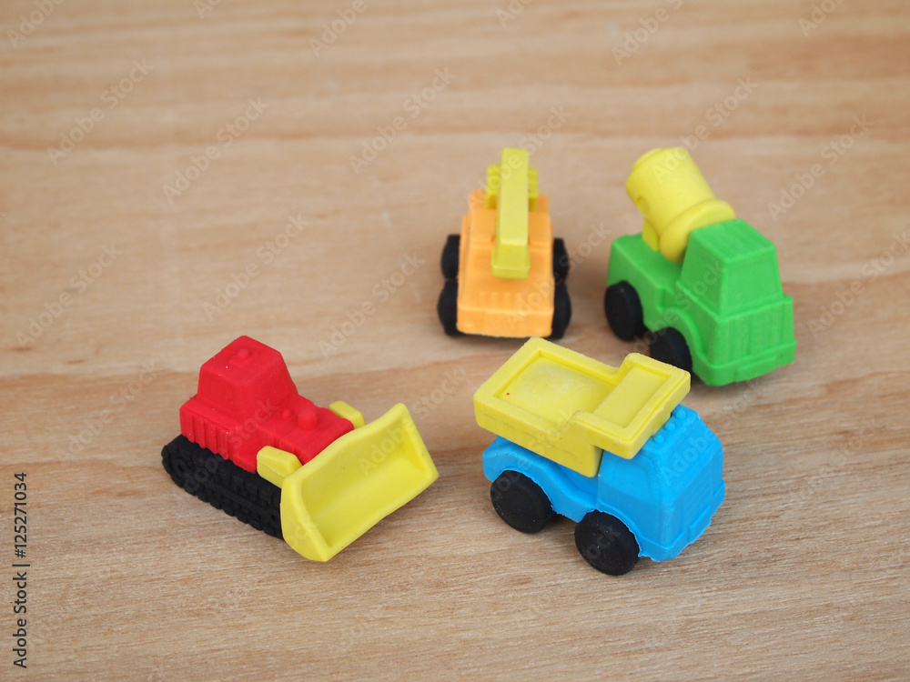 Naklejka premium Miniature model of construction heavy machine made from synthetic rubber. 