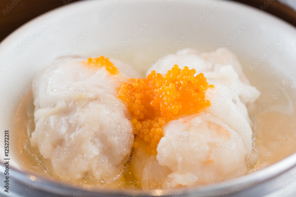 Steamed pork and shrimp dumplings with crab roe. Steamed pork and shrimp dumplings with crab roe.