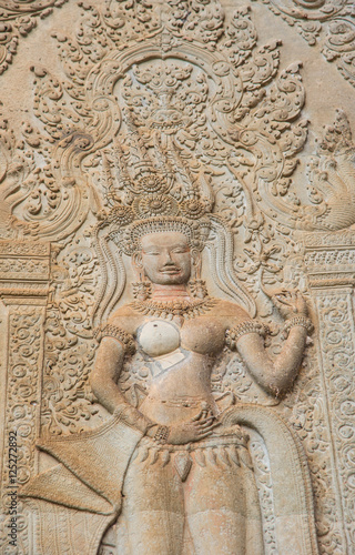 The Apsara stone sculpture in the corner of Angkor Wat the world biggest religious place in the world of Siem Reap province, Cambodia.
