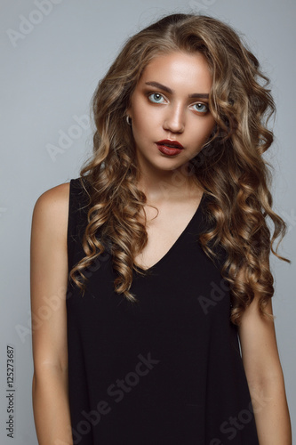 Close portrait of a beautiful girl with a professional make-up a