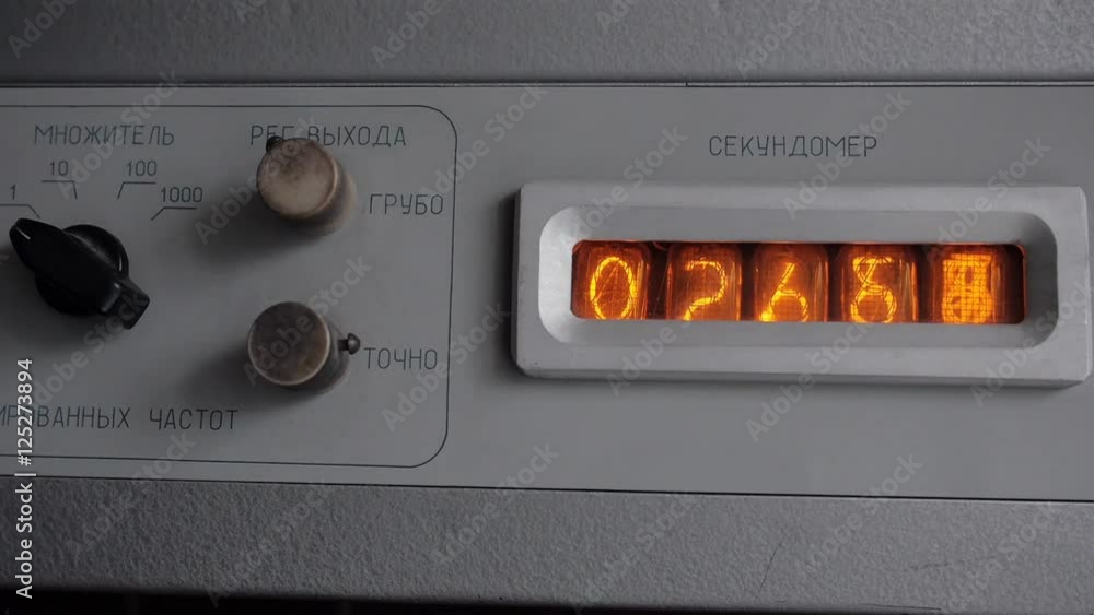 Obsolete vintage vacuum tube timer in the metal frame counting seconds ...