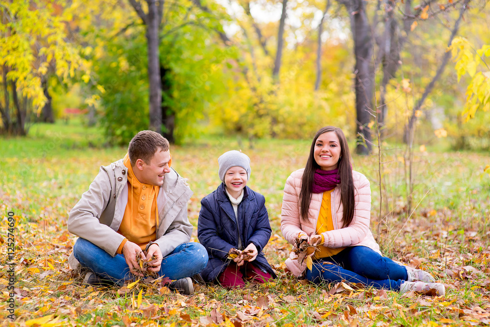 family playing with leaves autumn park family playing with leaves autumn park