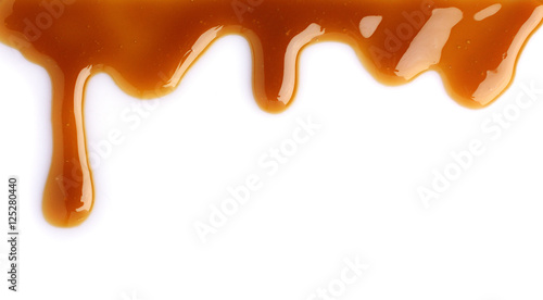 Melted caramel dripping photo
