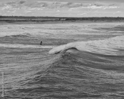 Paddle surfer going out © jaypetersen