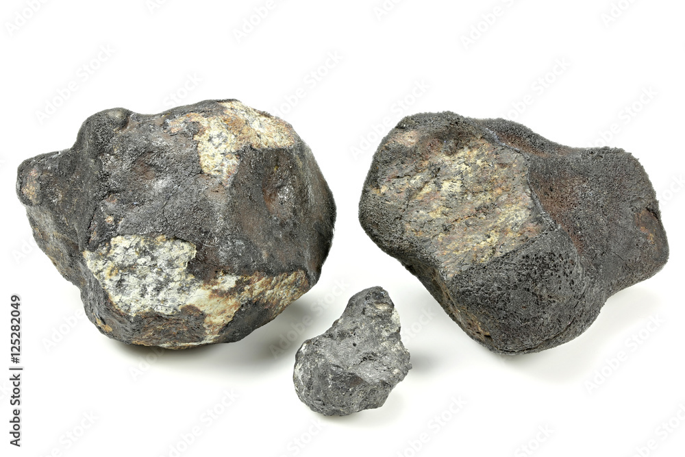fragments of the Chelyabinsk meteorite (fallen 15 February 2013) isolated on white background fragments of the Chelyabinsk meteorite (fallen 15 February 2013) isolated on white background