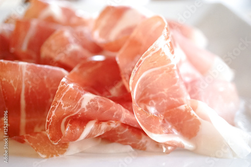 Photography Prosciutto di Parma or Parma Ham. Window Light. Soft Focus