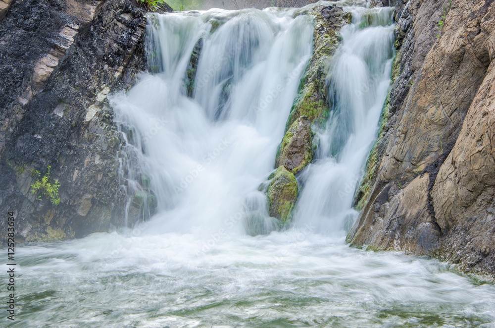 falling water in the morning mist. falling water in the morning mist.