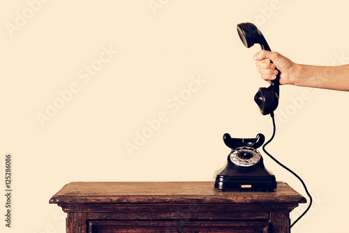 Konstfotografi antique telephone receiver in hand held