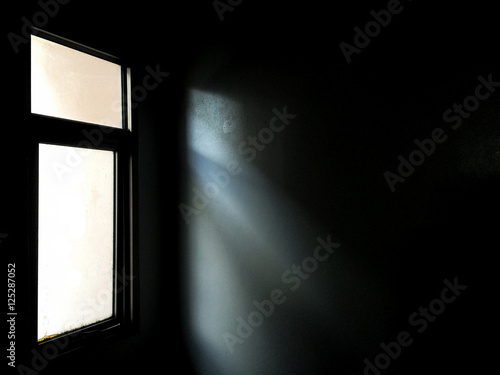 Light from a window in the dark room / Abstract with copy space / Mobile photography photo