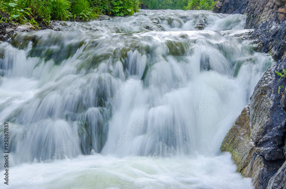 falling water in the morning mist. falling water in the morning mist.