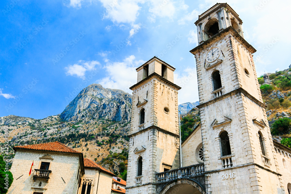 Cathedral Saint Tryphon is Roman Catholic cathedral in old town of Kotor, Montenegro. Lovcen mountain at background.