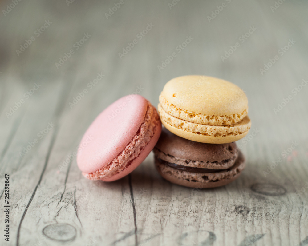 Colorful macaroons over turquoise wood backround Colorful macaroons over turquoise wood backround