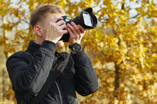 young photographer shoots nature landscape © Uladzislau
