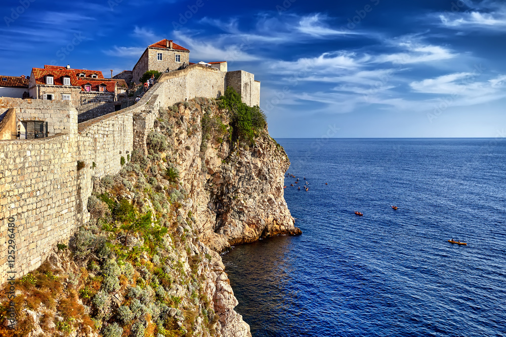 Dubrovnik, Croatia view from city walls overlooking walls and se Dubrovnik, Croatia view from city walls overlooking walls and se