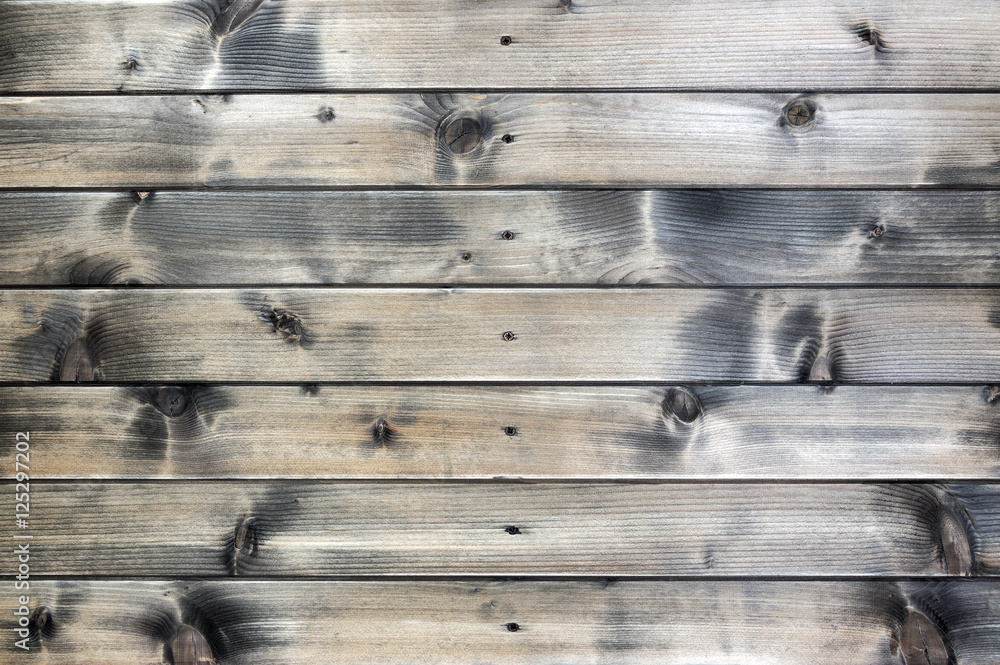 Closeup of a rustic wall built with natural wood planks Closeup of a rustic wall built with natural wood planks