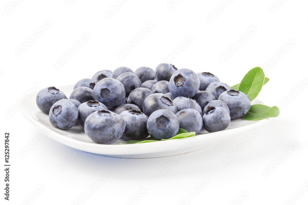 Close-up of fresh blueberries in white bowl on background Close-up of fresh blueberries in white bowl on background